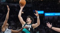 Portland Trail Blazers forward Deni Avdija (8) shoots over San Antonio Spurs guard De'aaron Fox (4) in the second half at Frost Bank Center.