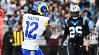 Los Angeles Rams wide receiver Puka Nacua (12) catches a touchdown against the Carolina Panthers in the first half during the NFC Wild Card Round game at Bank of America Stadium.