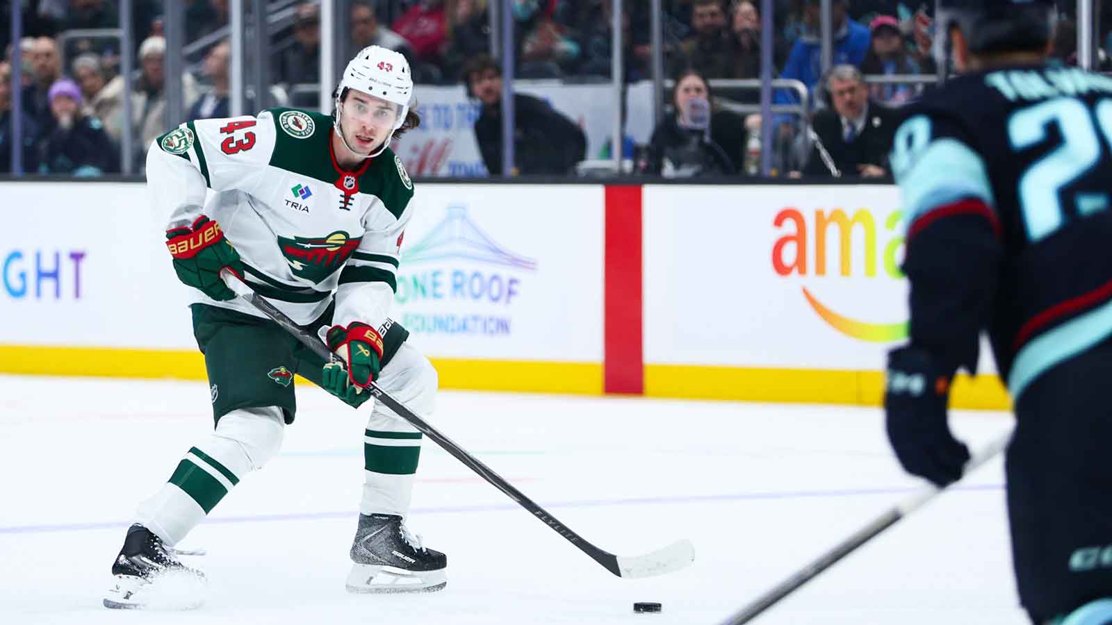 Minnesota Wild defenseman Quinn Hughes (43) looks to pass in the third period against the Seattle Kraken at Climate Pledge Arena.
