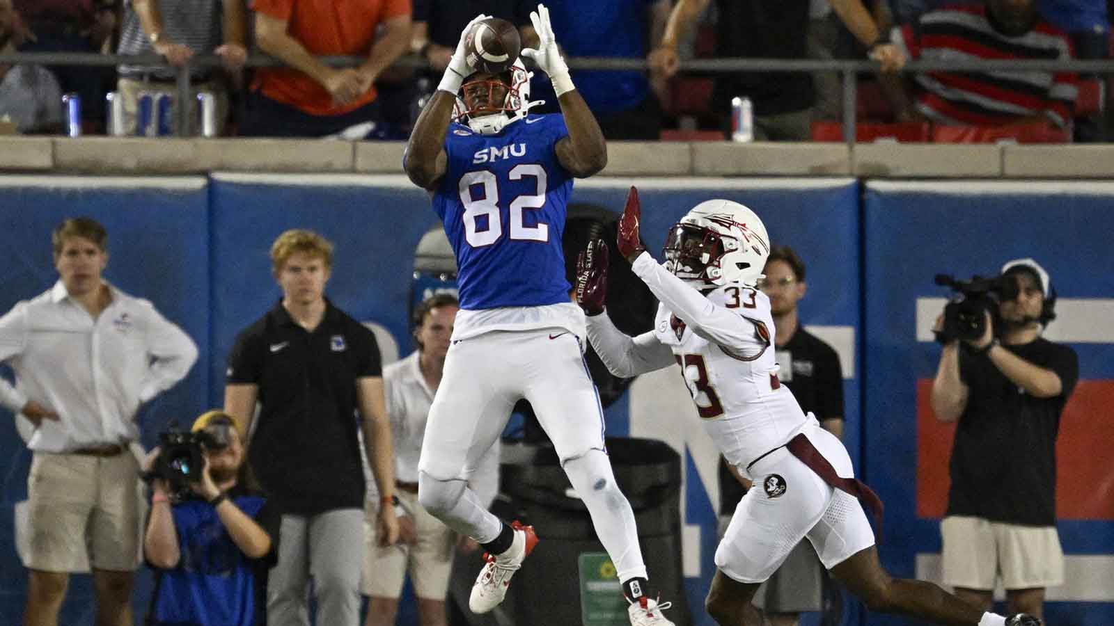 Southern Methodist Mustangs tight end RJ Maryland (82) catches a pass for a touchdown against Florida State Seminoles defensive back Edwin Joseph (33) during the second half at Gerald J. Ford Stadium.