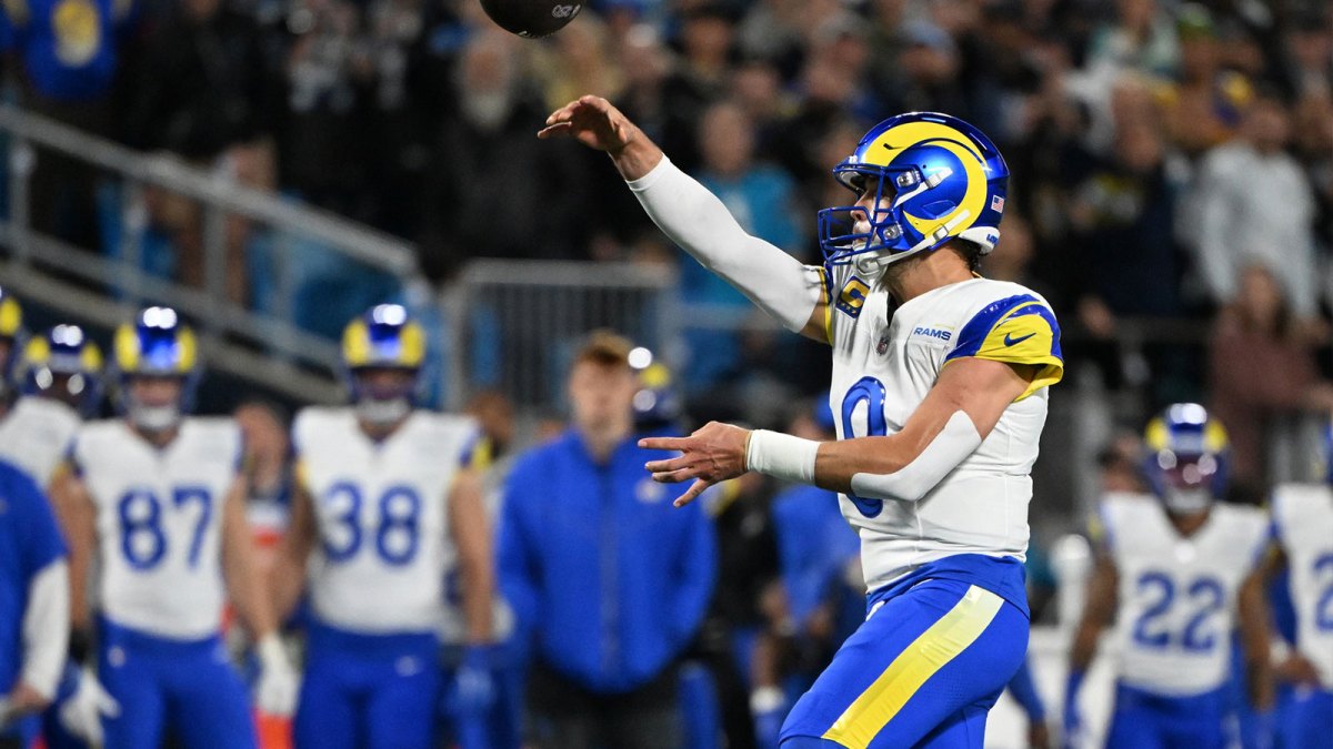 Los Angeles Rams quarterback Matthew Stafford (9) drops back to pass against the Carolina Panthers in the first half during the NFC Wild Card Round game at Bank of America Stadium.