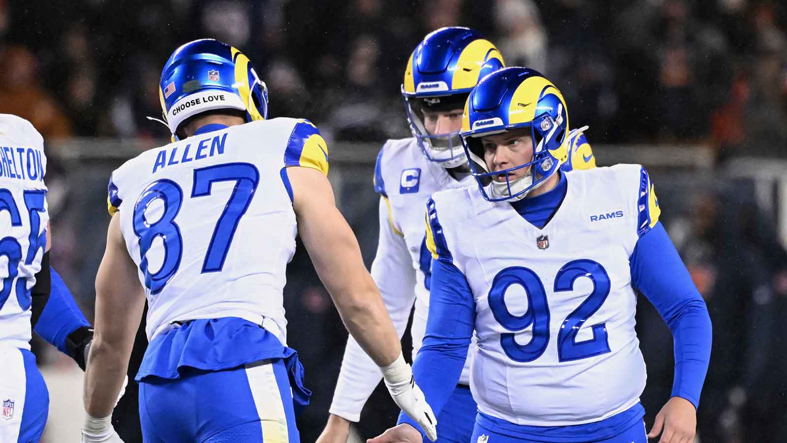 Los Angeles Rams placekicker Harrison Mevis (92) shakes hands with tight end Davis Allen (87) after kicking a thirty-two yard field goal against the Chicago Bears during the second quarter of an NFC Divisional Round game at Soldier Field.