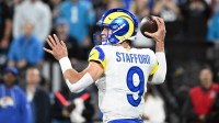 Los Angeles Rams quarterback Matthew Stafford (9) passes the ball in the fourth quarter in an NFC Wild Card Round game at Bank of America Stadium.