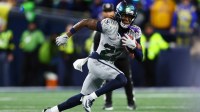 Seattle Seahawks wide receiver Rashid Shaheed (22) returns a punt for a touchdown against the Los Angeles Rams in the second half at Lumen Field.