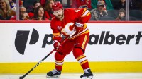 Calgary Flames defenseman Rasmus Andersson (4) controls the puck against the Nashville Predators during the second period at Scotiabank Saddledome.