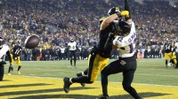 Pittsburgh Steelers tight end Pat Freiermuth (88) attempts to make a catch over Baltimore Ravens safety Alohi Gilman (12) during the second half at Acrisure Stadium.