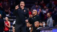 Dec 22, 2025; Tucson, Arizona, USA; Bethune-Cookman Wildcats head coach Reggie Theus yells out towards players during the first half of the game against the Arizona Wildcats at McKale Memorial Center.