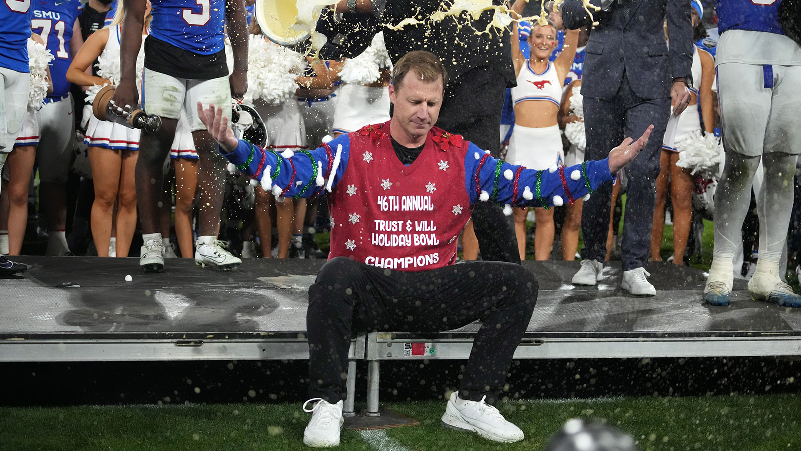 SMU Mustangs head coach Rhett Lashlee is doused with Egg Nog after victory over the Arizona Wildcats in the Holiday Bowl at Snapdragon Stadium.