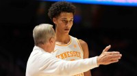 Tennessee basketball coach Rick Barnes talks with Tennessee forward Nate Ament (10) during an NCAA college basketball game against Rice on November 17, 2025, in Knoxville, Tenn.