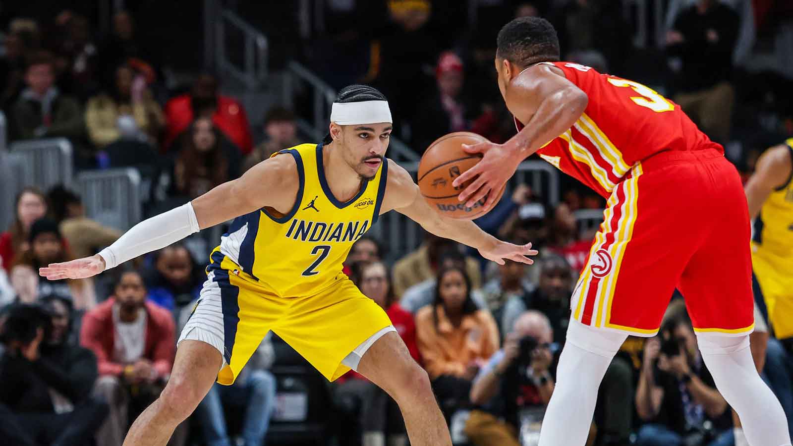 Atlanta Hawks guard CJ McCollum (3) looks for a play against Indiana Pacers guard Andrew Nembhard (2) during the third quarter at State Farm Arena.