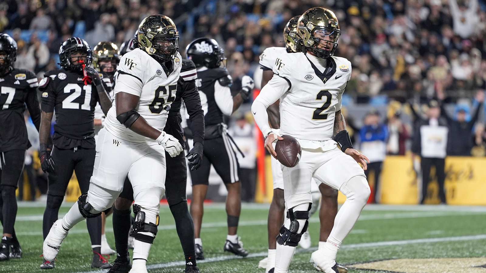 Wake Forest Demon Deacons quarterback Robby Ashford (2) runs in for a score against the Mississippi State Bulldogs during the second half at Bank of America Stadium.