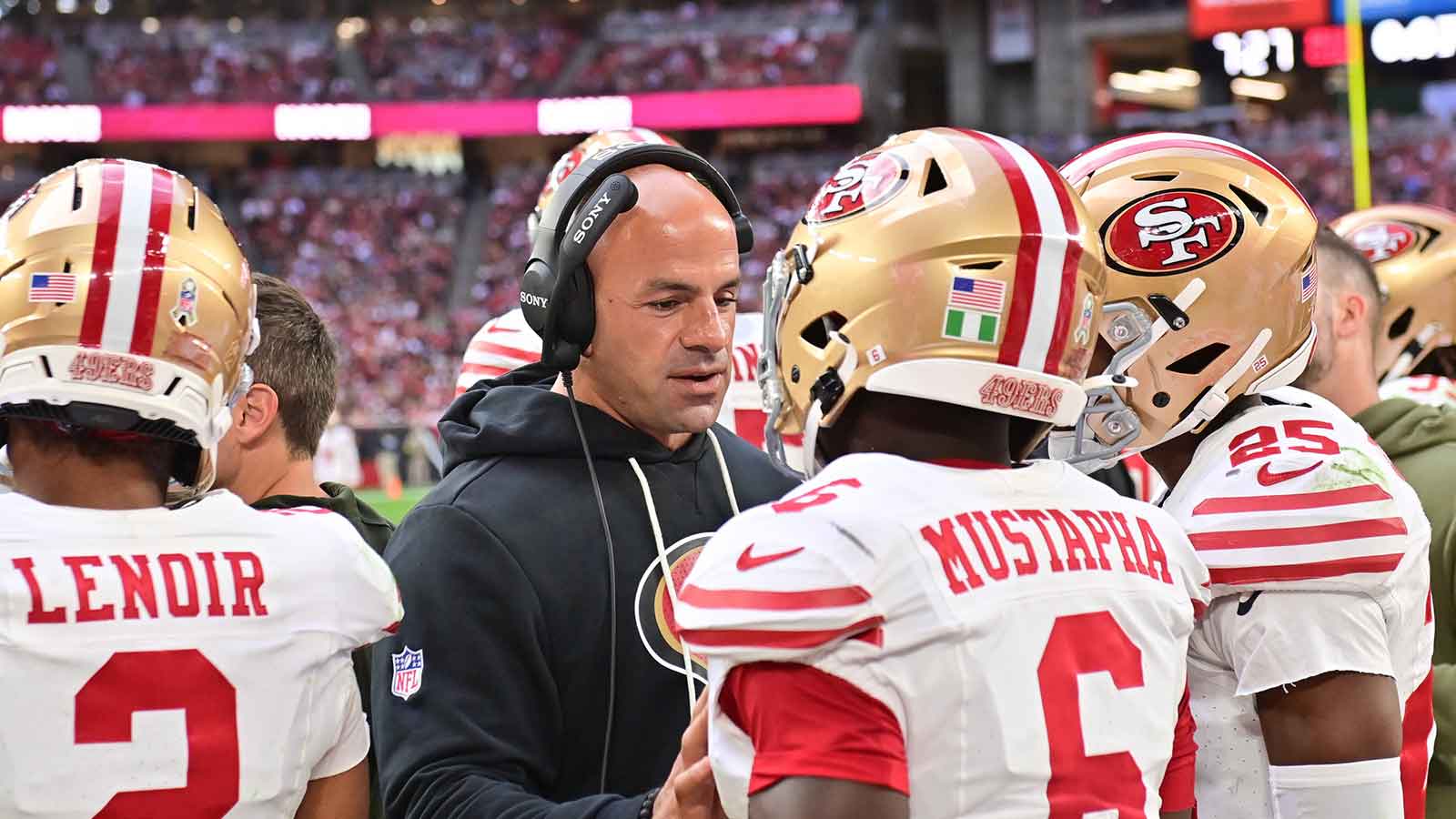 San Francisco 49ers defensive coordinator Robert Saleh speaks with 49ers safety Malik Mustapha (6) in the third quarter against the Arizona Cardinals at State Farm Stadium.