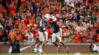 Auburn Tigers linebacker Robert Woodyard Jr. (0) celebrates his sack with defensive end Keldric Faulk (15) as Auburn Tigers take on Georgia Bulldogs at Jordan-Hare Stadium in Auburn