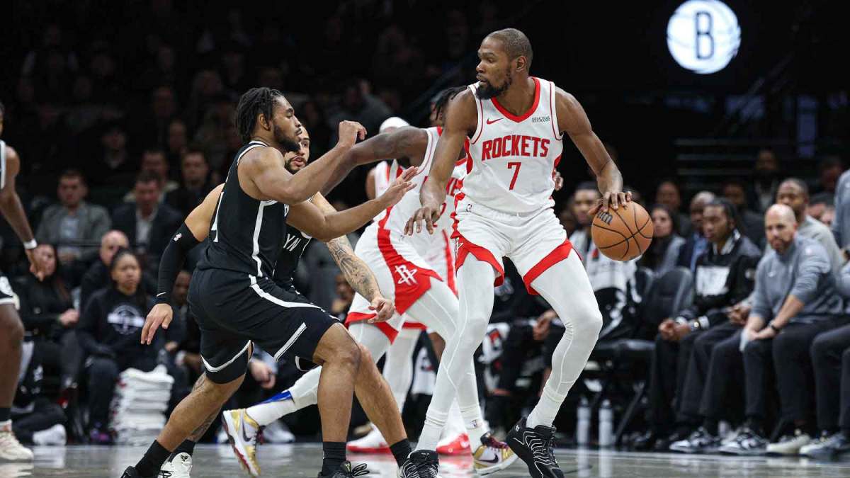 Rockets' Kevin Durant is guarded by Nets' Cam Thomas