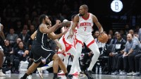 Rockets' Kevin Durant is guarded by Nets' Cam Thomas