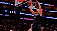 Rockets center Alperen Sengun (28) dunks