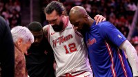 Houston Rockets center Steven Adams (12) is helped off the court after an injury against the New Orleans Pelicans during the fourth quarter at Toyota Center.