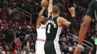 Houston Rockets forward Kevin Durant (7) shoots the ball as San Antonio Spurs forward Victor Wembanyama (1) defends during the first quarter at Toyota Center