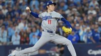 Los Angeles Dodgers pitcher Roki Sasaki (11) throws a pitch against the Toronto Blue Jays in the eighth inning for game six of the 2025 MLB World Series at Rogers Centre.