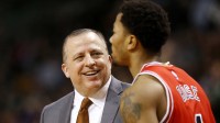 Chicago Bulls head coach Tom Thibodeau smiles at Chicago Bulls guard Derrick Rose (1) during the second half of the Chicago Bulls 109-102 win over the Boston Celtics at TD Garden