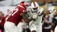 Indiana Hoosiers offensive lineman Kahlil Benson (67) attempts to block Miami Hurricanes defensive lineman Rueben Bain Jr. (4) in the first half during the College Football Playoff National Championship game at Hard Rock Stadium.