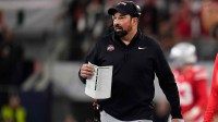 Ohio State Buckeyes head coach Ryan Day watches from the sideline during the Cotton Bowl at AT&T Stadium in Arlington, Texas for the College Football Playoff quarterfinal game against the Miami Hurricanes on Dec. 31, 2025.