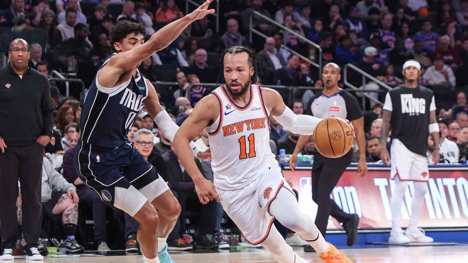 New York Knicks guard Jalen Brunson (11) drives past Dallas Mavericks guard Max Christie (00) in the first quarter at Madison Square Garden.