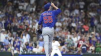 Chicago Cubs relief pitcher Ryan Pressly (55) points up after the final out during the ninth inning against the Houston Astros at Daikin Park.