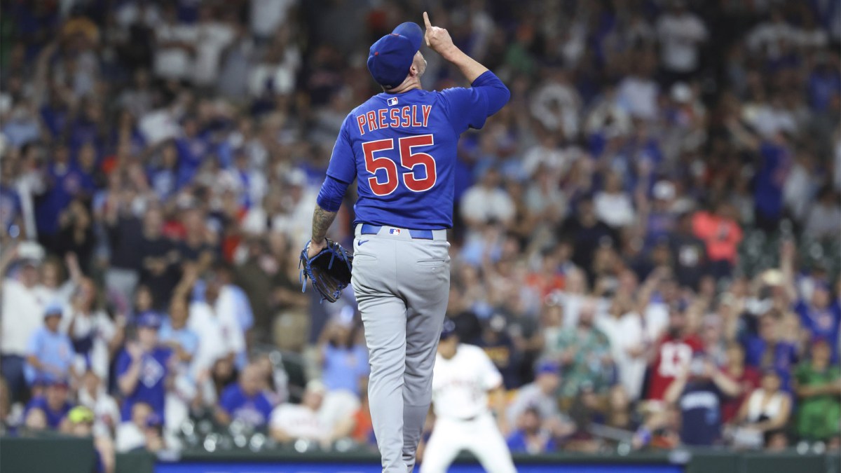 Chicago Cubs relief pitcher Ryan Pressly (55) points up after the final out during the ninth inning against the Houston Astros at Daikin Park.