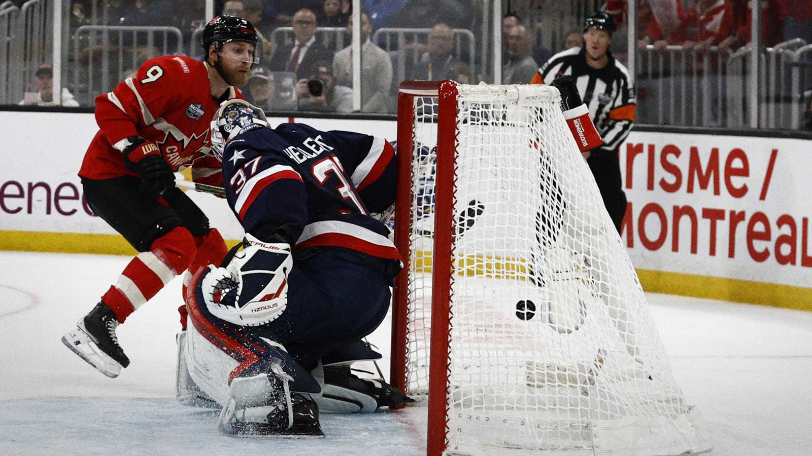Team Canada forward Sam Bennett (9) scores against Team USA goaltender Connor Hellebuyck (37) during the second period during the 4 Nations Face-Off ice hockey championship game at TD Garden.