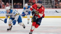 Florida Panthers center Sam Bennett (9) moves the puck against the St. Louis Blues during the second period at Amerant Bank Arena.