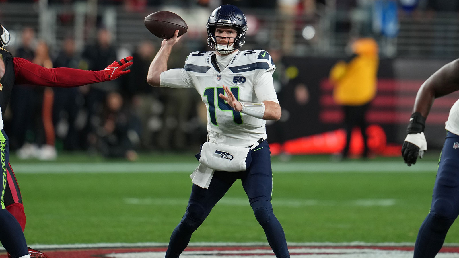 Seattle Seahawks quarterback Sam Darnold (14) drops back to pass against the San Francisco 49ers during the first half at Levi's Stadium.