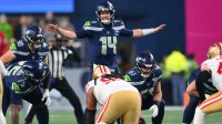 Seattle Seahawks quarterback Sam Darnold (14) calls a play at the line of scrimmage against the San Francisco 49ers during the first half in an NFC Divisional Round game at Lumen Field.