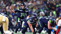 Jan 17, 2026; Seattle, WA, USA; Seattle Seahawks quarterback Sam Darnold (14) under center against the San Francisco 49ers during the second half in an NFC Divisional Round game at Lumen Field. Mandatory Credit: Kevin Ng-Imagn Images