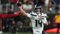 Seattle Seahawks quarterback Sam Darnold (14) drops back to pass against the San Francisco 49ers during the first half at Levi's Stadium.