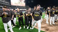 San Diego Padres players celebrate after the Padres clinched a spot in the National League Wild Card Series by beating the Milwaukee Brewers at Petco Park.
