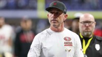 San Francisco 49ers head coach Kyle Shanahan leaves the field after the game against the Indianapolis Colts at Lucas Oil Stadium.