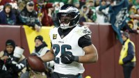 Philadelphia Eagles running back Saquon Barkley (26) celebrates after scoring a touchdown against the Washington Commanders in the second half at Northwest Stadium.