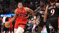 Toronto Raptors forward Scottie Barnes (4) dribbles the ball past Philadelphis 76ers center Adam Bona (30) in the second half at Scotiabank Arena.