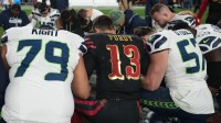 San Francisco 49ers quarterback Brock Purdy (13) prays after the game with the Seattle Seahawks players after the game at Levi's Stadium