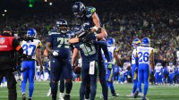 Seattle Seahawks wide receiver Cooper Kupp (10) celebrates with teammates after scoring a touchdown against the Los Angeles Rams during the second half in the 2026 NFC Championship Game at Lumen Field.
