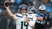 Seattle Seahawks quarterback Sam Darnold (14) throws a pass against the Carolina Panthers during the fourth quarter at Bank of America Stadium.