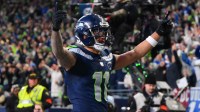 Seattle Seahawks wide receiver Jaxon Smith-Njigba (11) celebrates after scoring a touchdown against the Los Angeles Rams during the first half in the 2026 NFC Championship Game at Lumen Field.