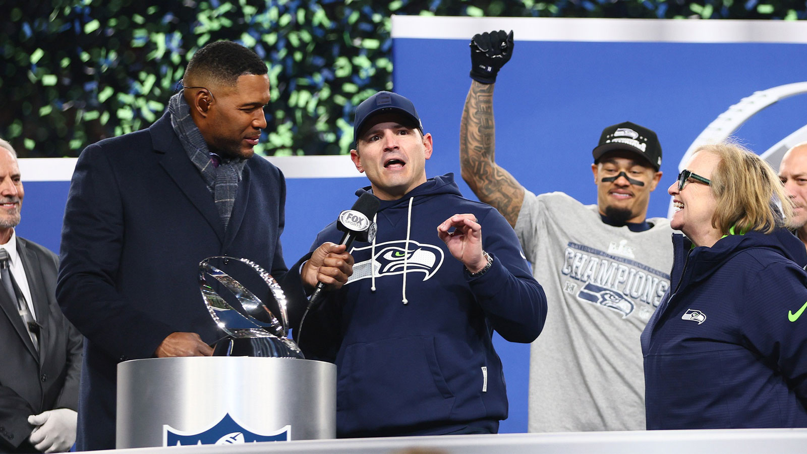 Seattle Seahawks head coach Mike MacDonald speaks on the podium after defeating the Los Angeles Rams in the 2026 NFC Championship Game at Lumen Field.