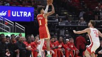 Atlanta Hawks forward Jalen Johnson (1) shoots the ball as Houston Rockets center Alperen Sengun (28) defends during the first quarter at Toyota Center.