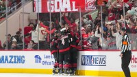 Carolina Hurricanes center Seth Jarvis (24) is congratulated by right wing Andrei Svechnikov (37), defenseman Shayne Gostisbehere (4) and left wing Nikolaj Ehlers (27) after his goal against the Dallas Stars during the second period at Lenovo Center.