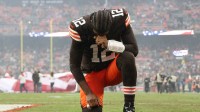 Cleveland Browns quarterback Shedeur Sanders (12) kneels before the game against the Pittsburgh Steelers at Huntington Bank Field.