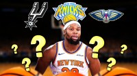 Knicks' Guerschon Yabusele with Spurs, Knicks, Pelicans logos