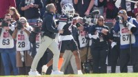 South Carolina Head Coach Shane Beamer congratulates South Carolina wide receiver Vandrevius Jacobs (4) after his long touchdown catch