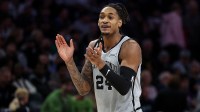 San Antonio Spurs guard Devin Vassell (24) reacts during the first half against the Minnesota Timberwolves at Target Center.
